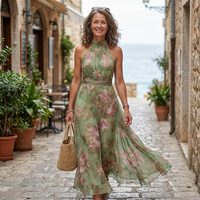 Serena™ | Long green dress with a floral print and a halter neck